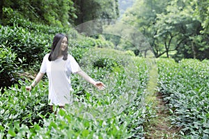 A happy free smile peace balance meditation beauty girl Asian Chinese travel hiking smell maple stand by a lake bag hangzhou xihu