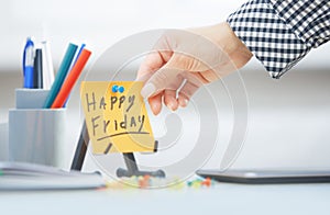 Happy Friday text on adhesive note