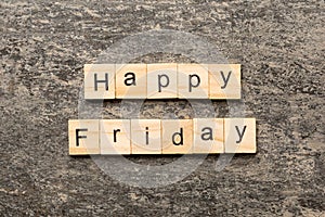Happy friday word written on wood block. Happy friday text on cement table for your desing, concept