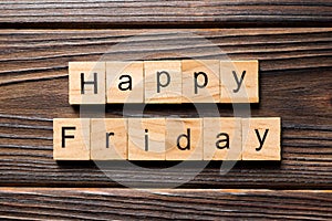 Happy friday word written on wood block. Happy friday text on wooden table for your desing, concept