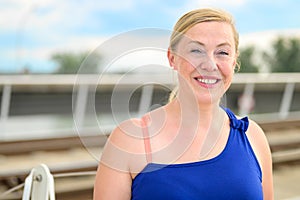 Happy friendly blond woman with a lovely beaming smile