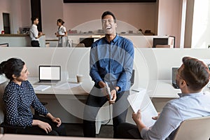 Happy friendly business team people diverse coworkers laugh at workplace