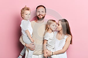 Happy friendly family and their childre posing to camera