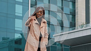 Happy friendly smiling attractive young african american woman business lady manager stretching out waving hand, making