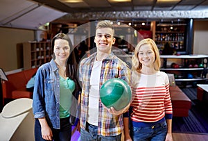 Happy friends in bowling club