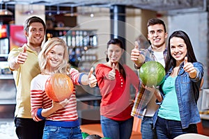 Happy friends in bowling club