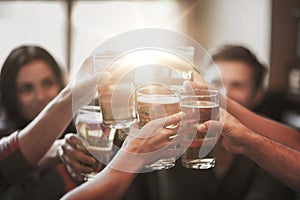 Happy friends drinking beer at bar or pub