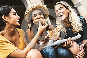 Happy friends eating street food on summer vacation