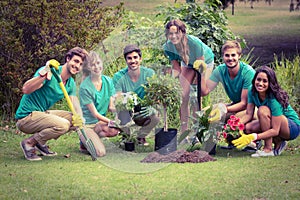 Happy friends gardening for the community