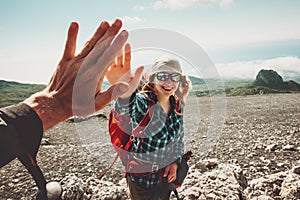 Happy Friends giving five hands traveling at mountains