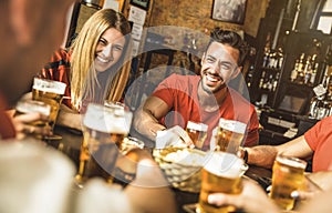 Happy friends group drinking beer at brewery bar restaurant