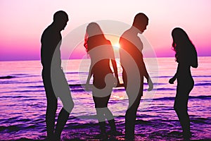 Happy friends having fun on tropical beach at sunset - Group of young people having enjoying summer vacation - Youth lifestyle,