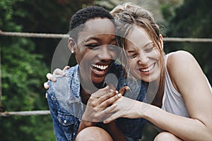 Happy friends holding each other photo