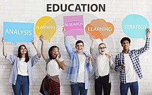 Happy friends holding placards with features of successful education