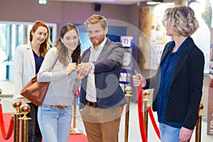 Happy friends meeting in cinema