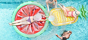 Happy friends playing with air lilo ball inside swimming pool - Young people having fun on summer vacation - Travel, holidays,