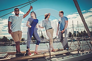 Happy friends resting on a yacht