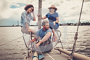 Happy friends resting on a yacht