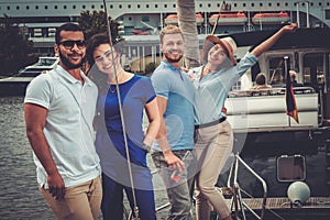 Happy friends resting on a yacht