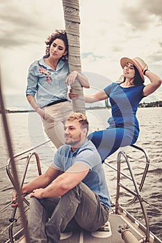 Happy friends resting on a yacht