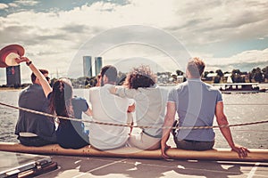 Happy friends resting on a yacht