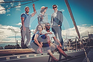 Happy friends resting on a yacht