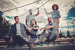 Happy friends resting on a yacht