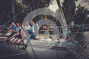 Happy friends resting on a yacht