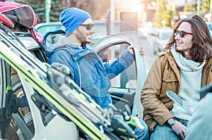 Happy friends at ski vacation village for winter sporty holidays outdoor - Young skiers having fun at sunrise parking the car -