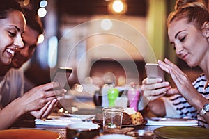 Happy friends take a food picture for instagram