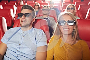 Happy friends watching movie in 3d theater