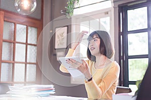 Happy fun asian young woman using smartphone