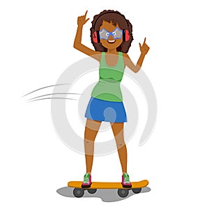 Happy funny african american woman in headphones listening to music while riding a skateboard