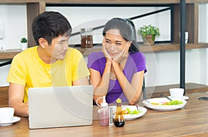 Happy and funny family. Asian lovely couple, beautiful woman and handsome man is having American breakfast