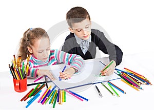 Happy funny kids draw. The boy and the girl draws pencils. Creativity concept.