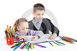 Happy funny kids draw. The boy and the girl draws pencils. Creativity concept.