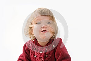 Happy funny little girl emotional playing. cute caucasian blond baby girl with bear and doll