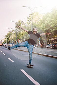 Happy and funny skateboarder ride skateboard through the city st