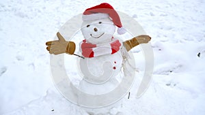 Happy funny snowman in the snow. Making snow man and winter fun.