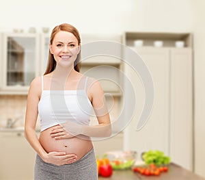 Happy future mother touching her belly