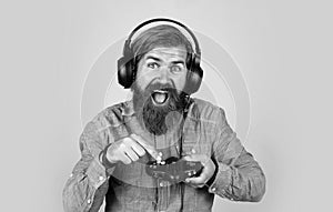 happy gamer play computer games. man playing video games. online game. concept of tv gaming. man in headphones with