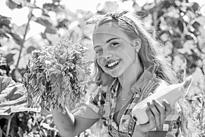 Happy gardener girl growing fresh food just from farm