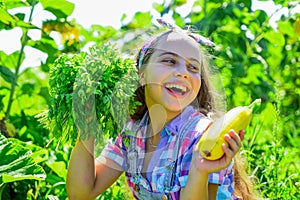 Happy gardener girl hold homegrown food just from farm