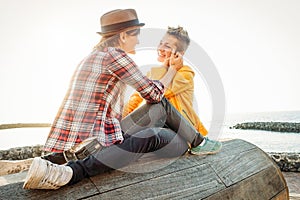 Happy gay couple in romantic date on the beach - Young lesbians having a tender moment outdoor