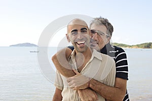 Happy gay couple on vacation photo