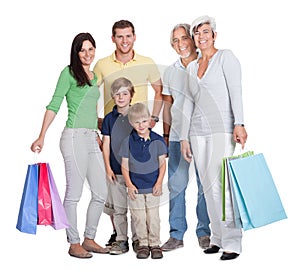 Happy generations family with shopping bags