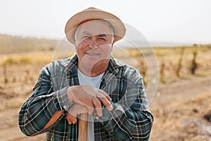 Happy and Genuine Senior Hispanic Farmer's Portrait with a Grin