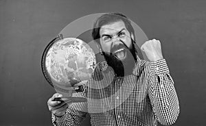 happy geographer man with beard look at globe. ready for studying. nonformal education. student in school classroom