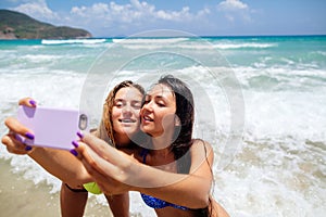 Happy gilrls selfie on beach