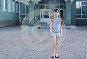 Happy girl with backpack going to school